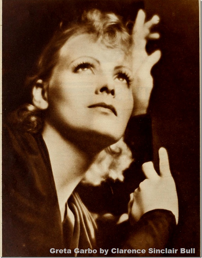 Dramatic photo of Greta Garbo, her left hand against the side of her head. 