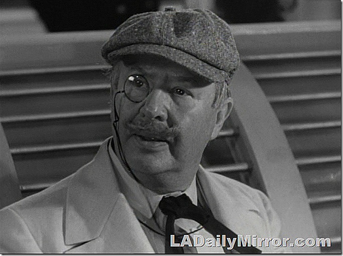 Mysterious fellow with a cap and a monocle. 