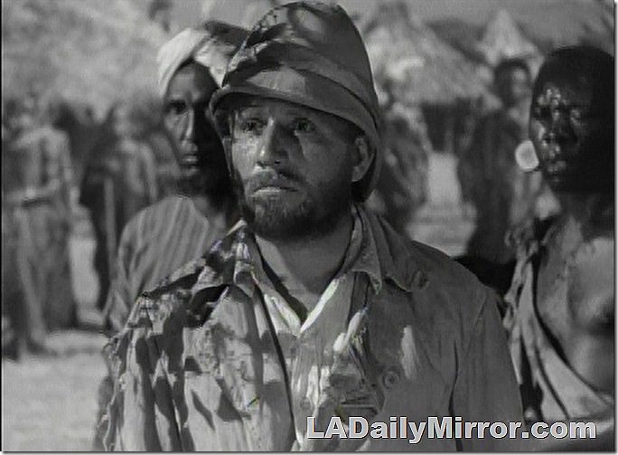 Bearded man wearing pith helmet. 