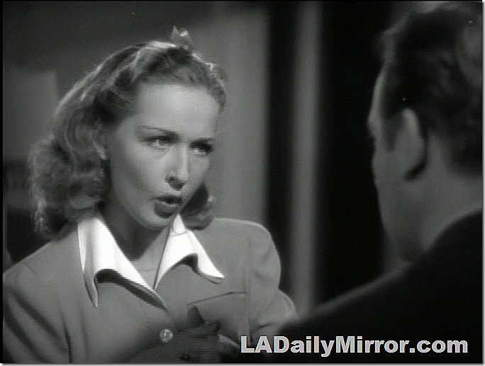Woman with dress over shirt collar and ribbon in her hair. And Back of the Head Guy Woman with dress over shirt collar and ribbon in her hair. And Back of the Head Guy