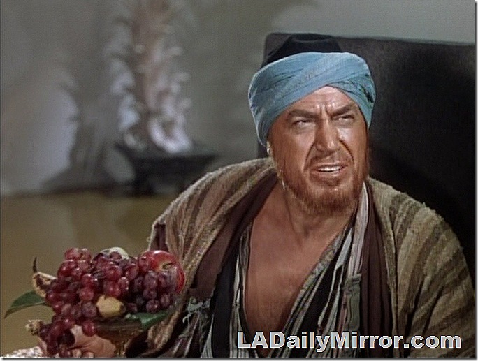 Man with beard and in turban with bowl of fruit. Man with beard and in turban with bowl of fruit.