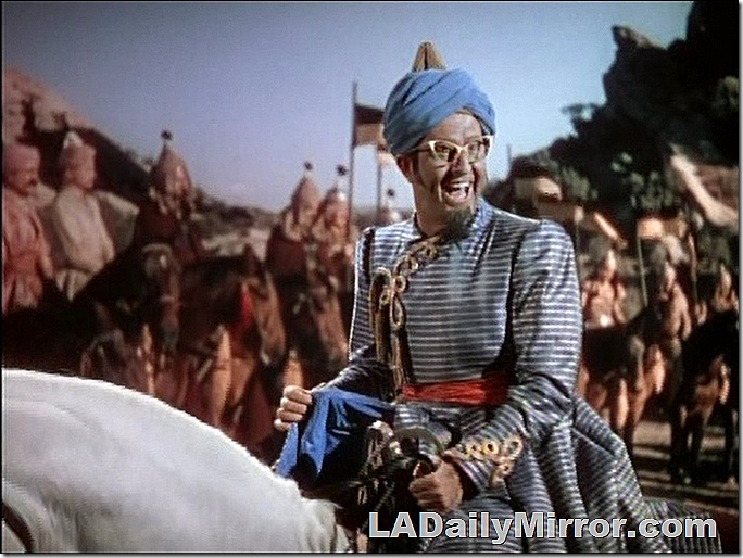 Man in glasses, wearing turban, on horseback. Man in glasses, wearing turban, on horseback.