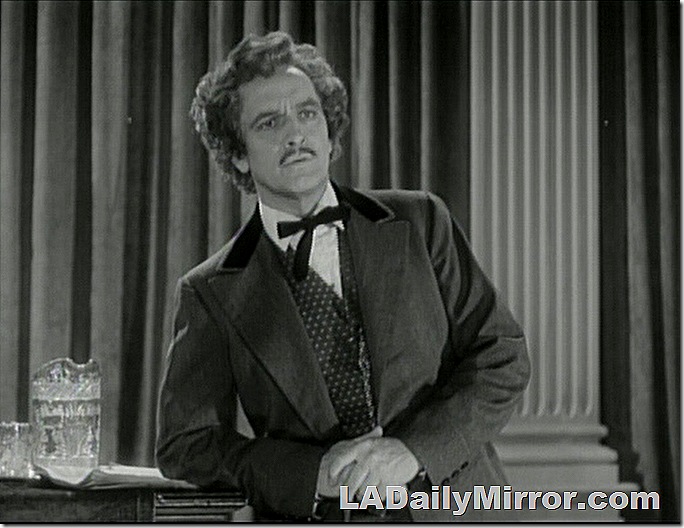 Man in suit, vest, string tie with luxurious coiffure. And mustache. Man in suit, vest, string tie with luxurious coiffure. And mustache.