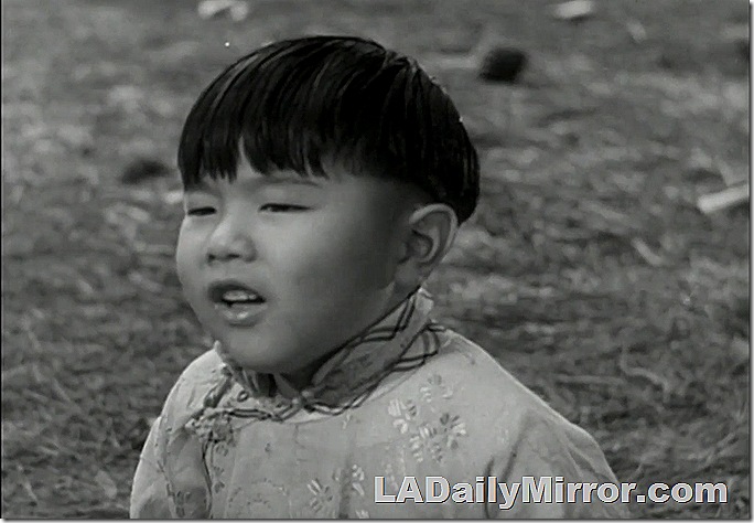 Asian boy in traditional outfit. 