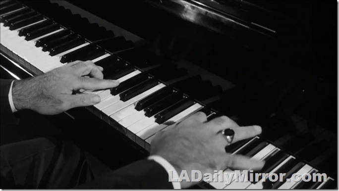 Hands of a man playing the piano. 