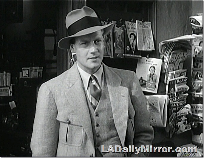 Man in three-piece suit with broad-brimmed hat. 