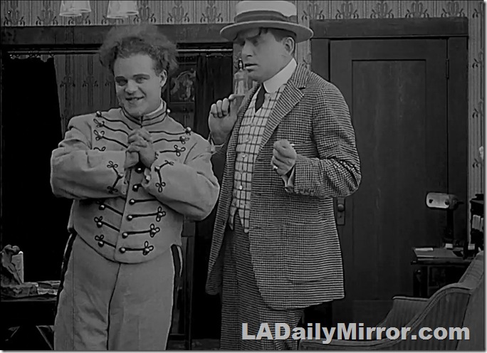 Man in uniform with wild hair. 