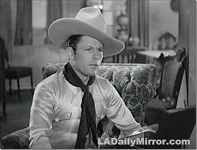 Cowboy with long bandana and huge hat. 