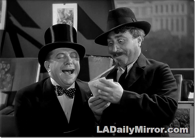 Man in top hat laughing. His mysterious companion pops his eyes. Man in top hat laughing. His mysterious companion pops his eyes.