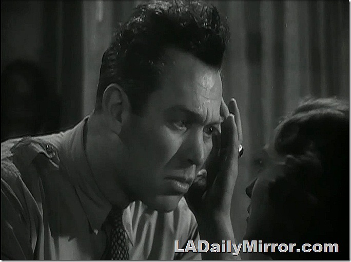 Man with mussed hair, face to face with mysterious woman. 