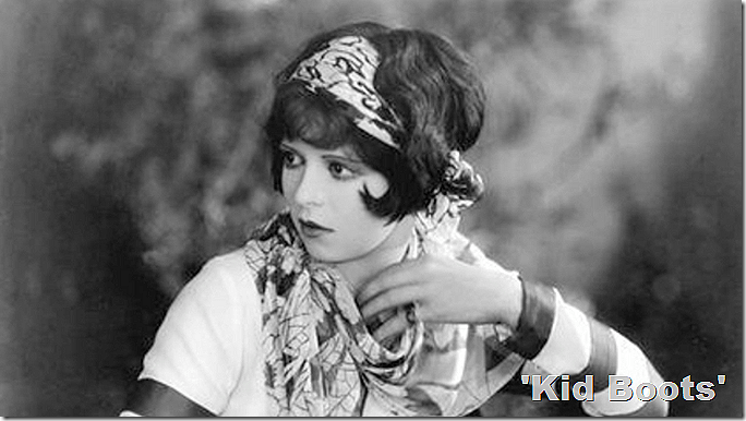 Clara Bow in 'Kid Boots.' She has short hair tied with a scarf. Clara Bow in 'Kid Boots.' She has short hair tied with a scarf.