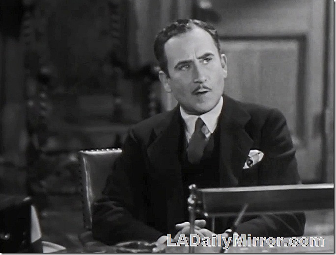 Man in suit and tie, with small mustache. 