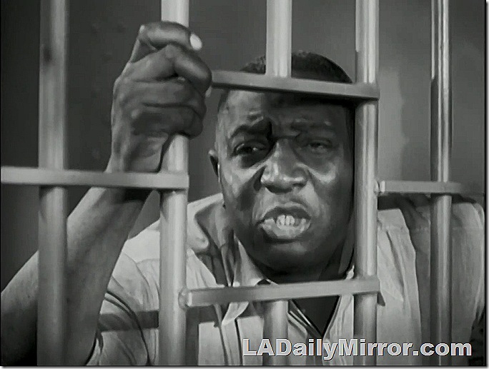 Mysterious man behind bars. 