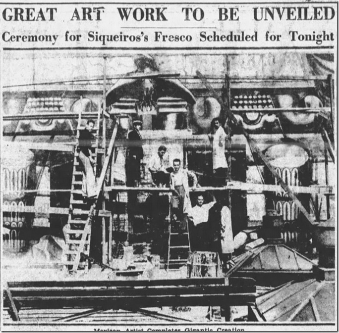 America Tropical mural with men posing on scaffolding. 