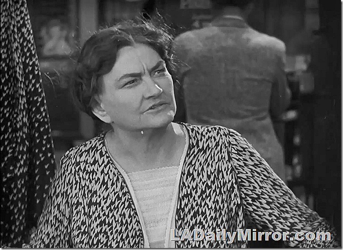 Woman with short hair wearing dress with busy design. Woman with short hair wearing dress with busy design.