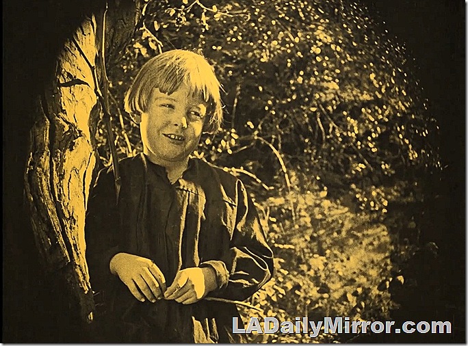 Child leaning against a tree. Child leaning against a tree.