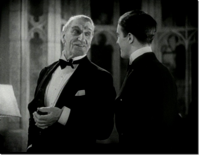 An older man (we he ever young?) in a tuxedo talking to a young man in a tuxedo. An older man (we he ever young?) in a tuxedo talking to a young man in a tuxedo.