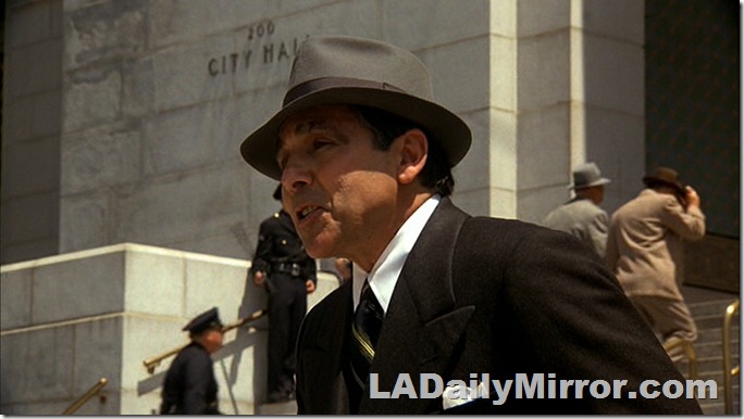 Man in hat and double-breasted suit. 