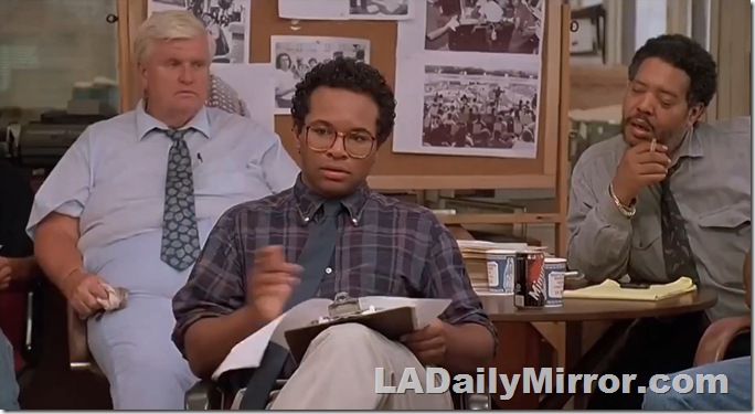 Three men sitting in an office. 