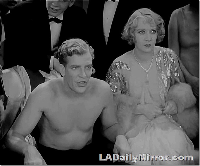 Lady in elegant dress next to shirtless man Lady in elegant dress next to shirtless man