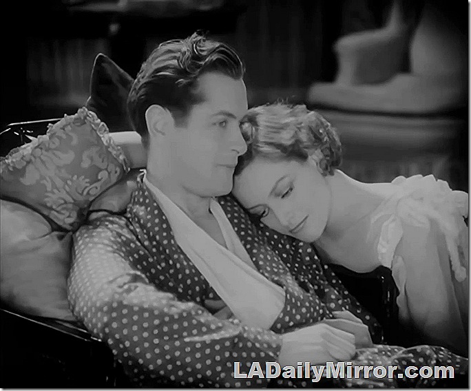 Man on couch, with mystery woman leaning on his shoulder. Man on couch, with mystery woman leaning on his shoulder.