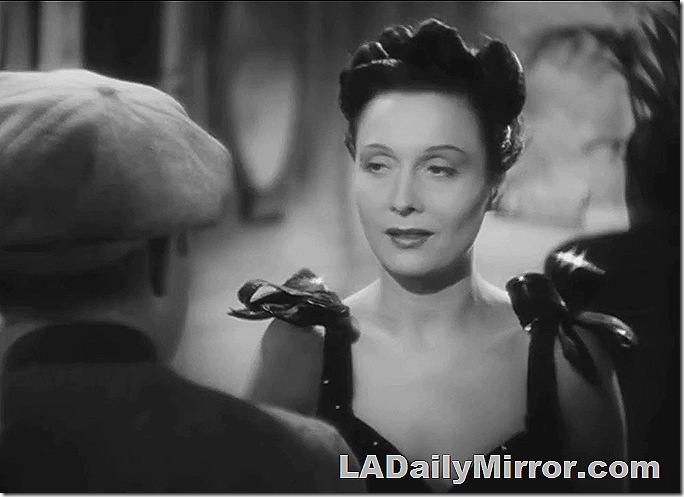 Woman in fancy dress talking to Back of the Head Guy