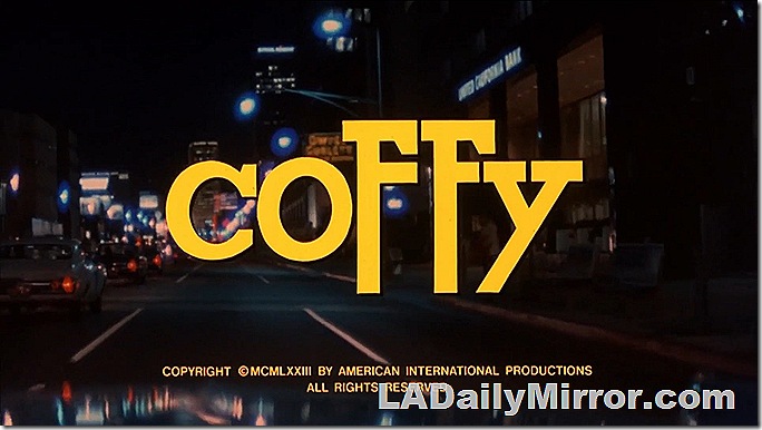 Main Title: Lettering over nighttime shot of busy street with buildings in the background.
