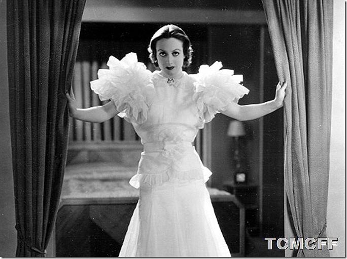 Joan Crawford backlit in a white dress in a scene from Letty Lynton.