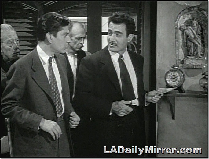 Men in suits and ties. One man is holding a piece of paper. Men in suits and ties. One man is holding a piece of paper.