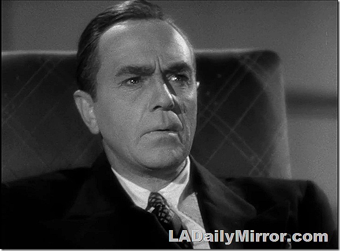 Man in coat and tie, with a disoriented look
