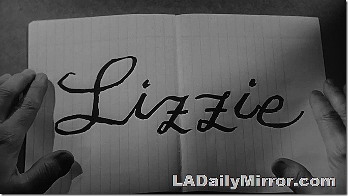 Main title: Cursive writing on a piece of notebook paper. 