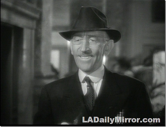 Man with hat and slight mustache doing an awkward smile. Man with hat and slight mustache doing an awkward smile.