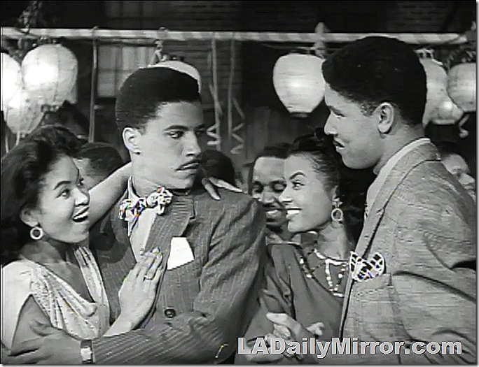 Two couples on a dance floor. The men double-breasted suits and have slight mustaches. The women are elegantly dressed. Two couples on a dance floor. The men double-breasted suits and have slight mustaches. The women are elegantly dressed.