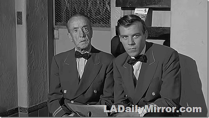 Men in uniforms with bow ties. One man is much older than the other. Men in uniforms with bow ties. One man is much older than the other.