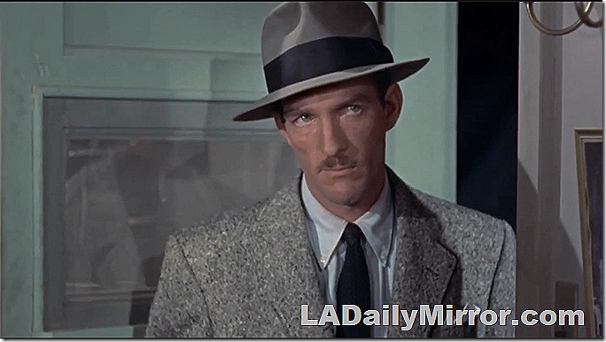 Man in suit, tie and fedora with slight mustache. Man in suit, tie and fedora with slight mustache.