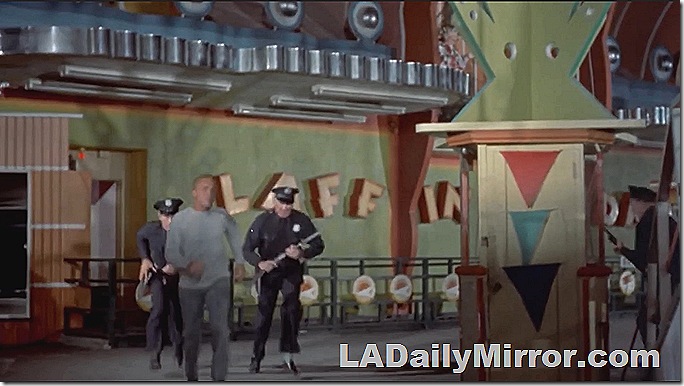 Actors in front of an amusement park ride. Actors in front of an amusement park ride.