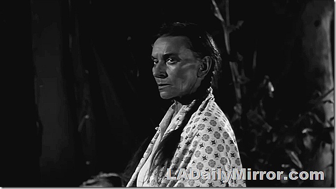 Woman with hair in a long pigtail. 