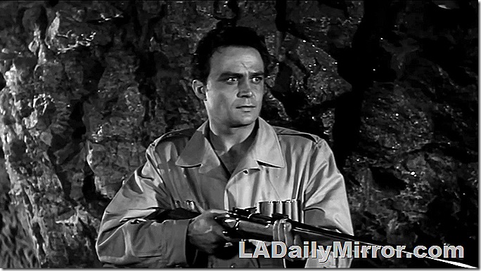 Man in safari jacket with bolt-action rifle. Man in safari jacket with bolt-action rifle.