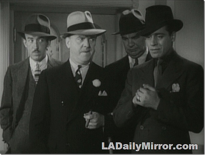 Four tough guys in suits and hats. 