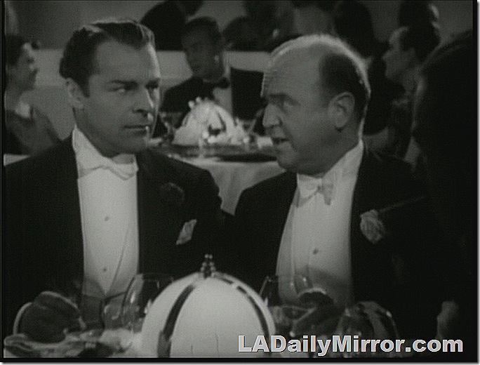 Two mysterious fellows in tuxedos. 