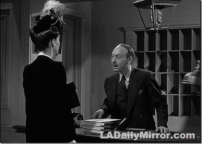 Hotel clerk with Back of the Head Woman in a coat and elaborate hat Hotel clerk with Back of the Head Woman in a coat and elaborate hat