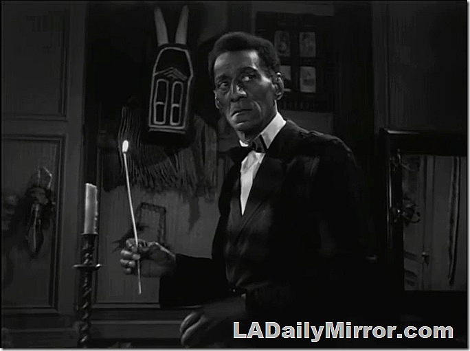Man in tuxedo holding candle. Man in tuxedo holding candle.