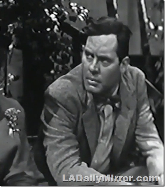 Man in coat and bowtie, sitting. Man in coat and bowtie, sitting.